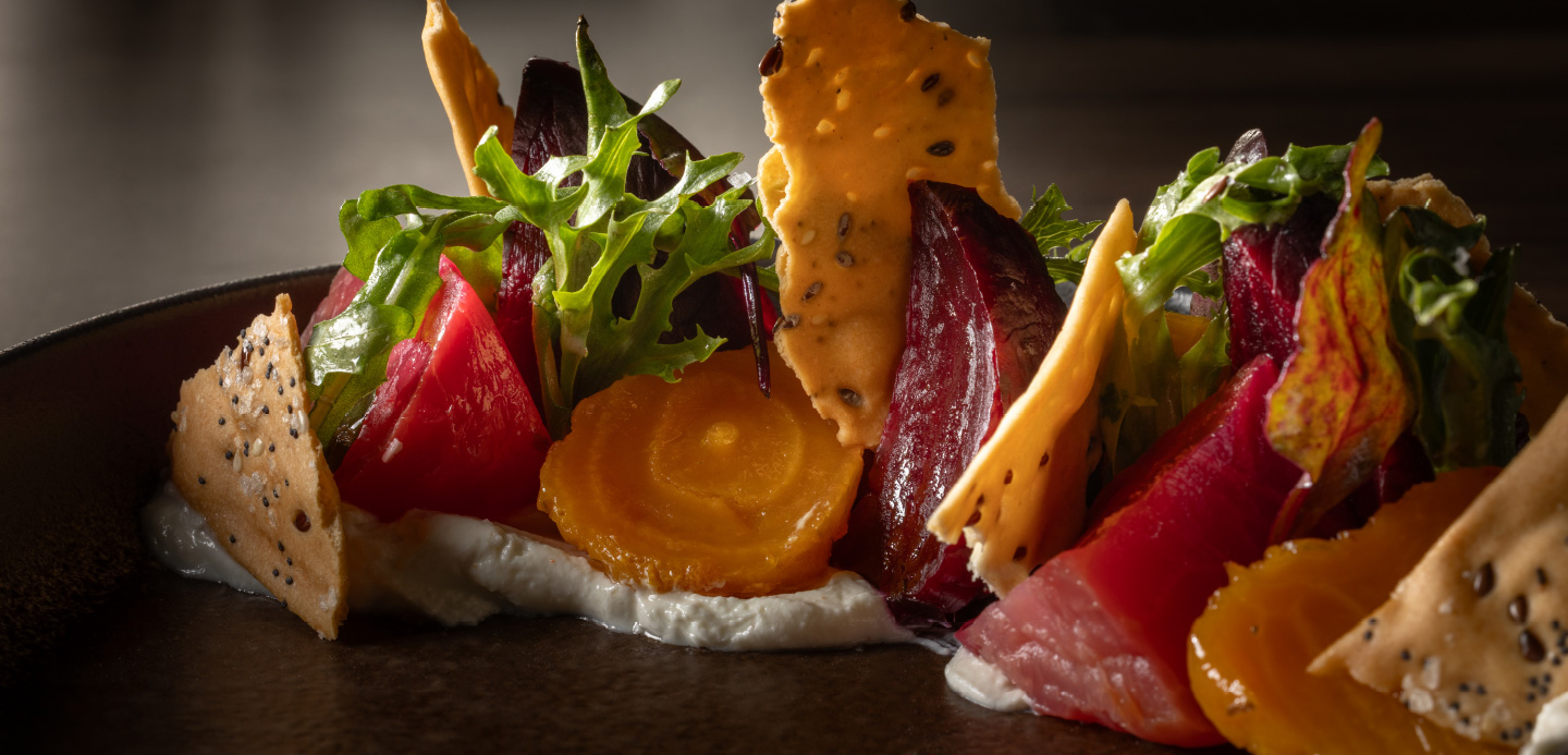 Vibrant roasted beet salad with whipped goat cheese, toasted nuts, and fresh microgreens at Katerina Restaurant in Stone Oak, San Antonio.