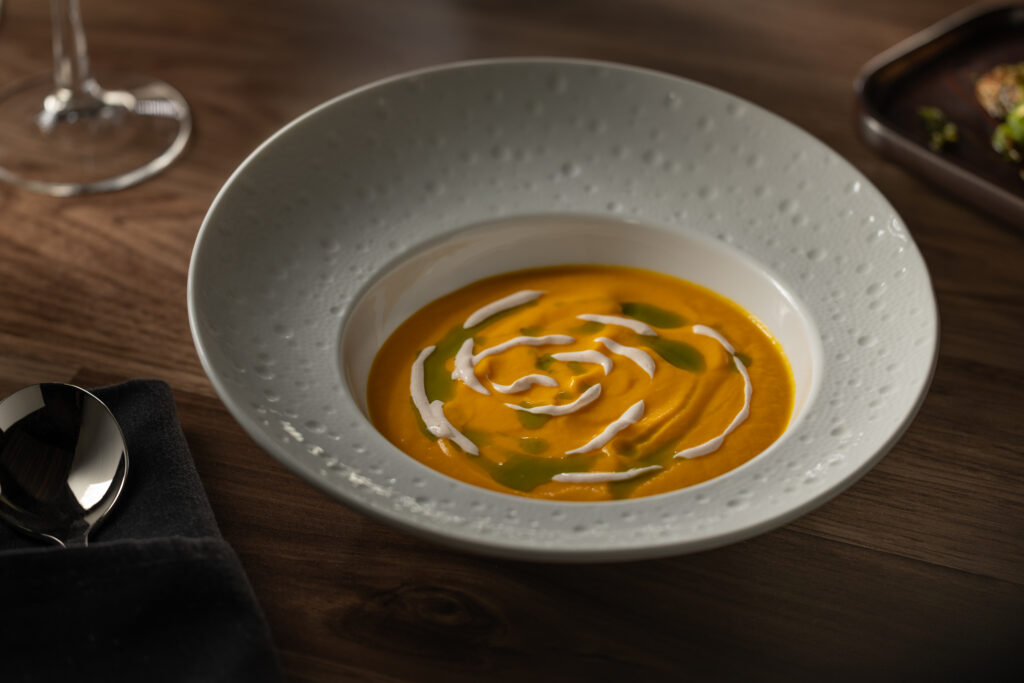 Butternut squash soup with spiced crema and chive oil at Katerina Restaurant