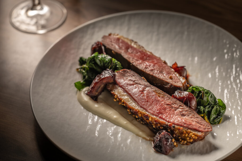 Coriander crusted duck breast with parsnip puree, broccolini and dates at Katerina Restaurant