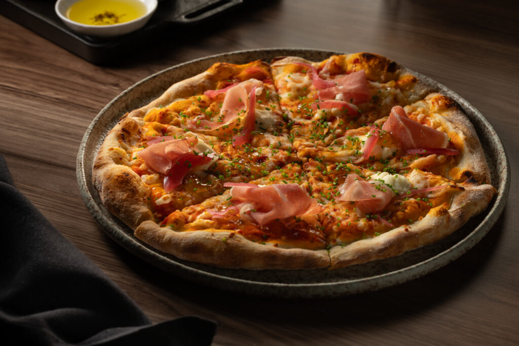 Prosciutto and fig pizza with mozzarella, whipped ricotta, marinara and fig jam at Katerina Restaurant