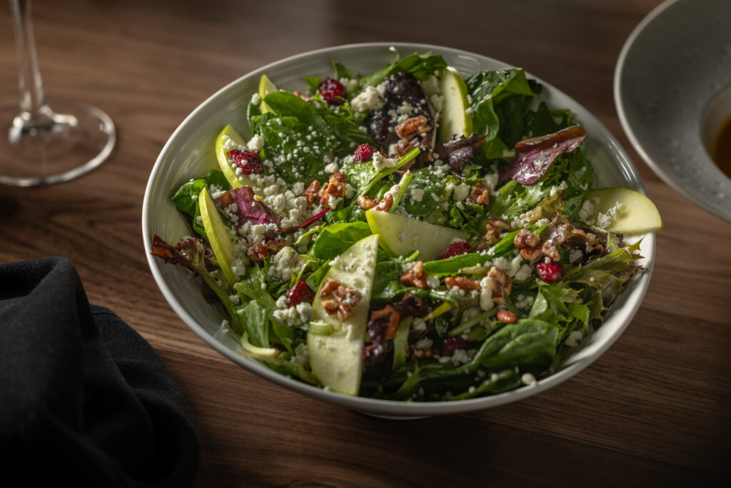 Stone Oak salad with apples, dried cherries, aged white cheddar and candied pecans at Katerina Restaurant